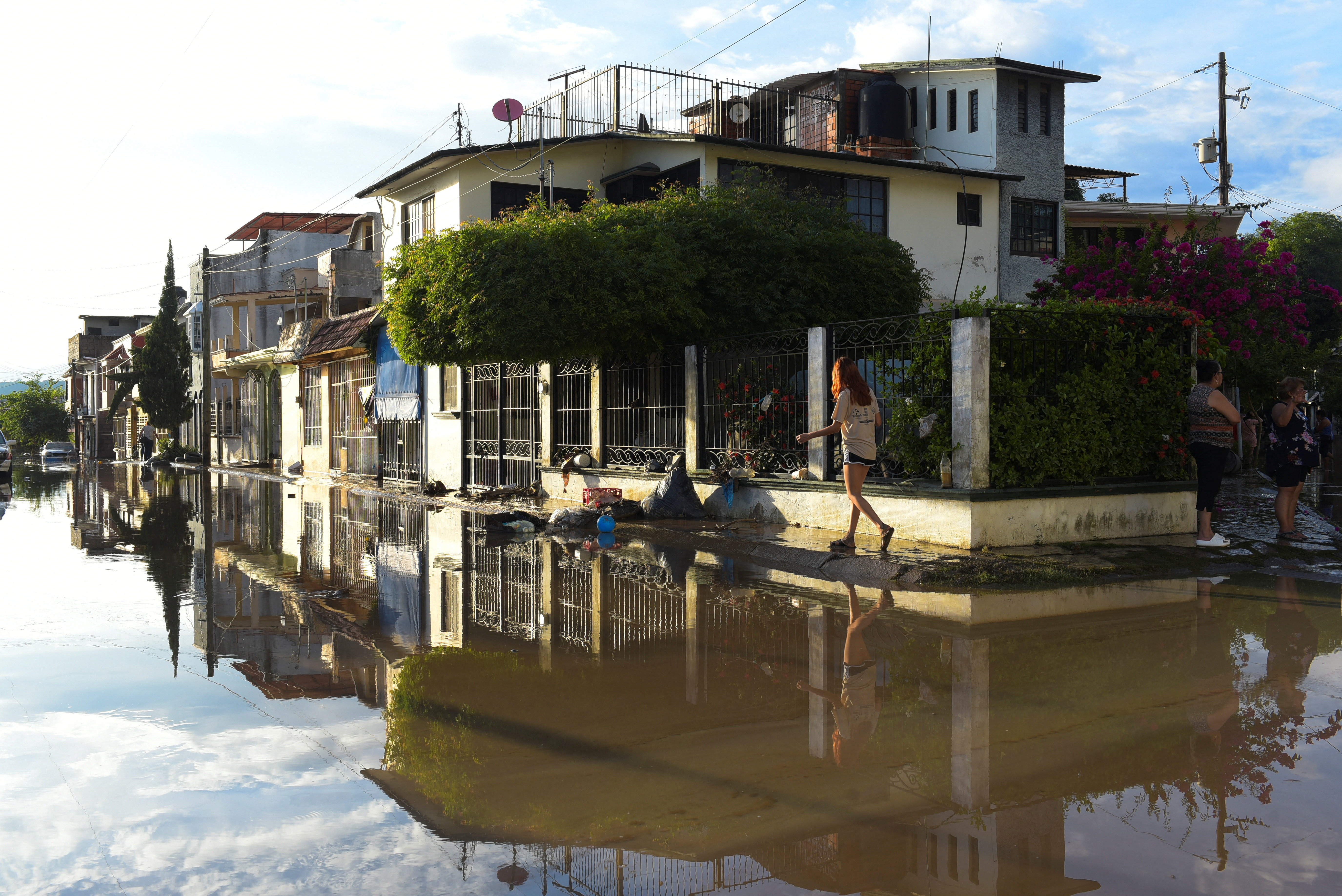 Torrential rains burst rivers, sparking floods in eastern Mexico