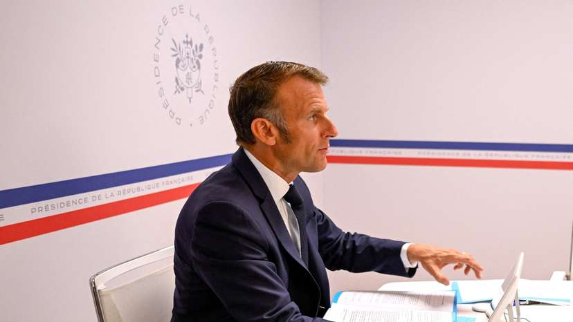 FILE PHOTO: French President Emmanuel Macron attends a video conference  with members of the “coalition of the willing”