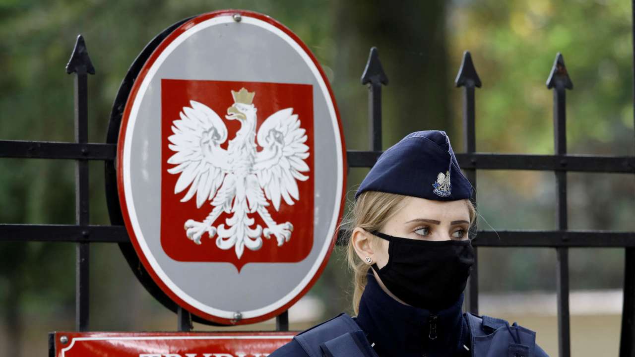 FILE PHOTO: Police officer stands outside Constitutional Tribunal building in Warsaw