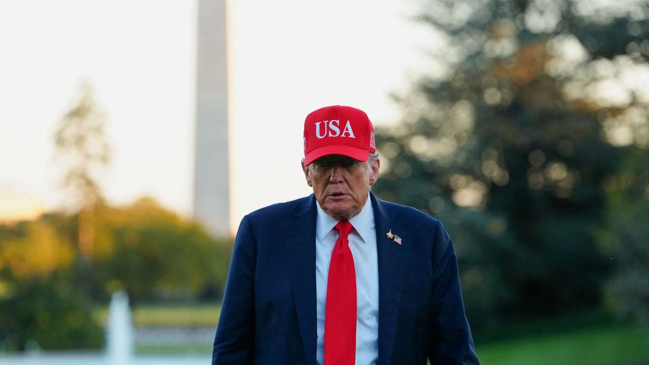U.S. President Donald Trump returns at the White House, in Washington
