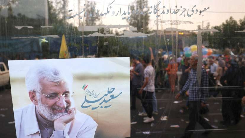 FILE PHOTO: A poster of Iranian presidential candidate Saeed Jalili is seen on a street in Tehran