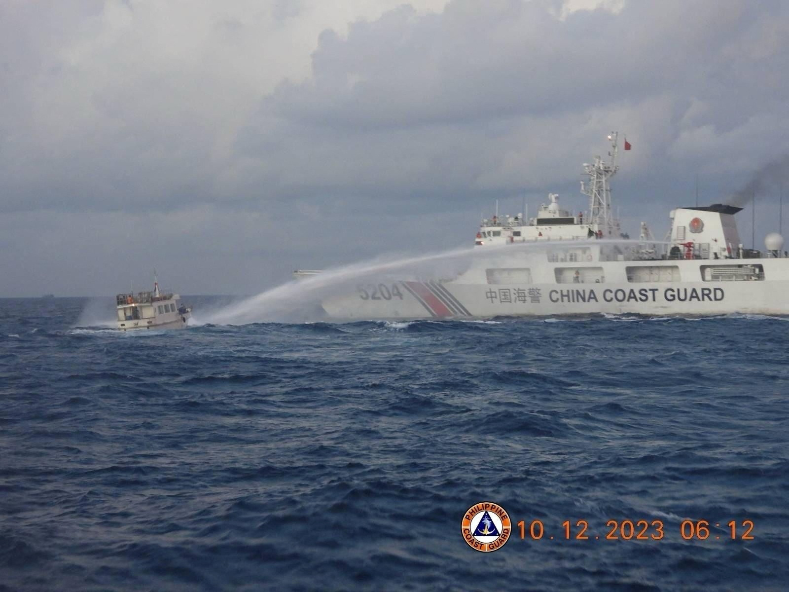 Chinese Coast Guard ship uses water cannon against a Filipino resupply vessel