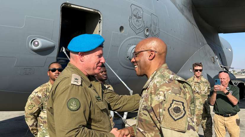 U.S. Air Force General Charles Q. Brown Jr. is greeted by an Israeli military official, at Ben Gurion International Airport outside Tel Aviv