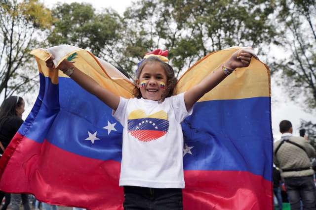 Venezuelans cast their vote to elect president, in Bogota