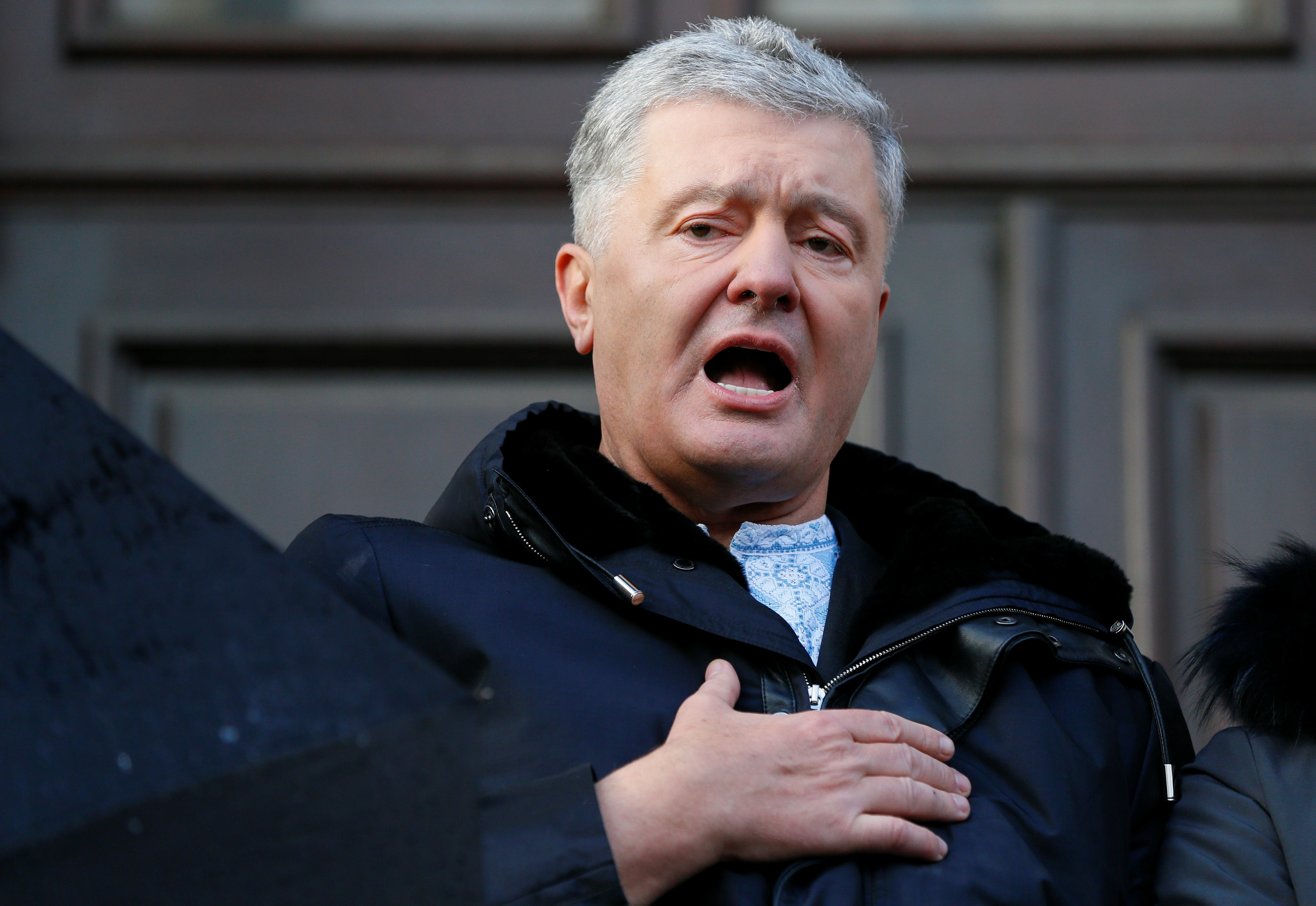Ukrainian former President Poroshenko leaves a court building in Kyiv