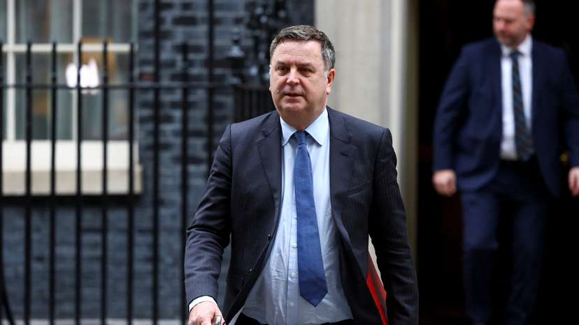 Britain's Secretary of State for Work and Pensions Stride walks outside Downing Street, in London