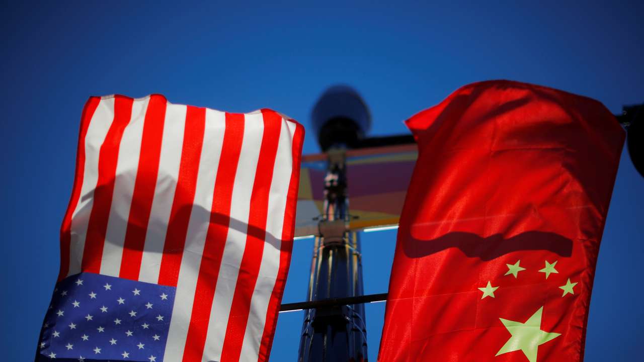 The flags of the United States and China fly in Boston