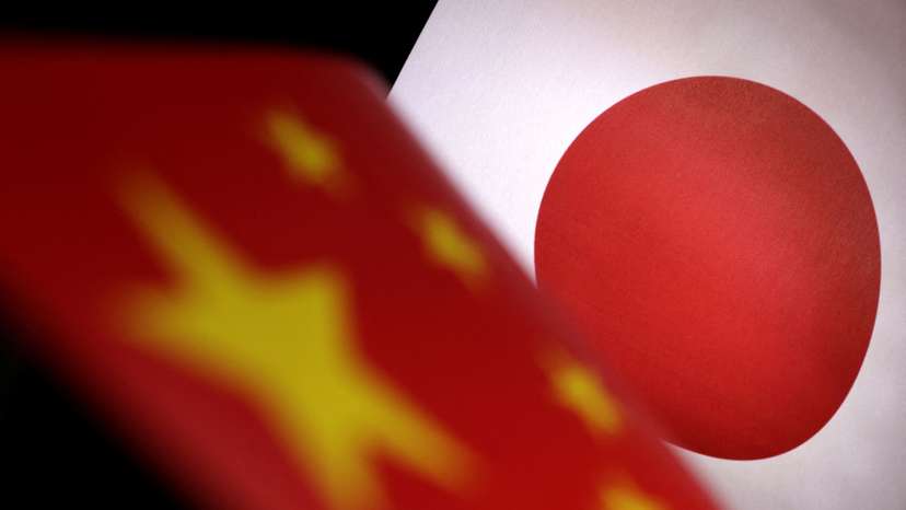 Illustration shows printed Chinese and Japanese flags