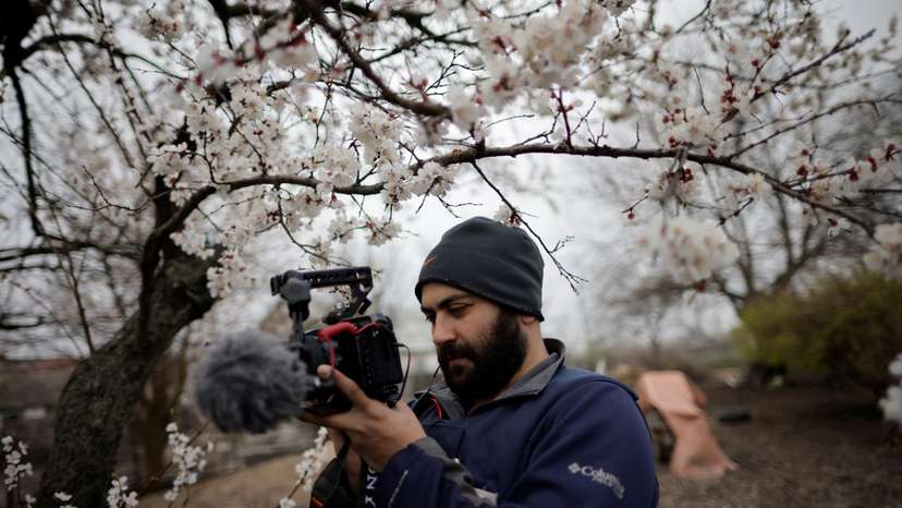 Reuters' journalist Issam Abdallah films Ukrainian woman Zhanna Lishchynska (not pictured) during an interview with Reuters, in Zaporizhzhya