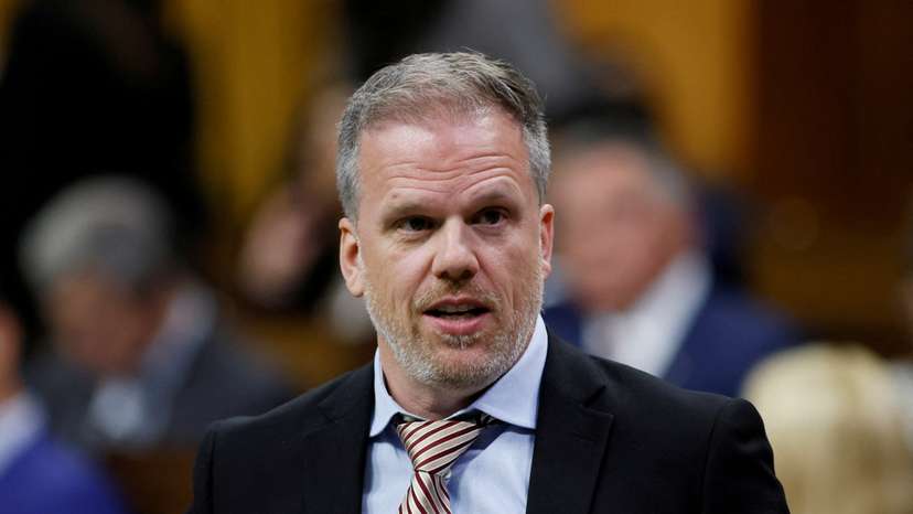 FILE PHOTO: Canada's Minister of Health Mark Holland rises to table a report in the House of Commons on Parliament Hill in Ottawa