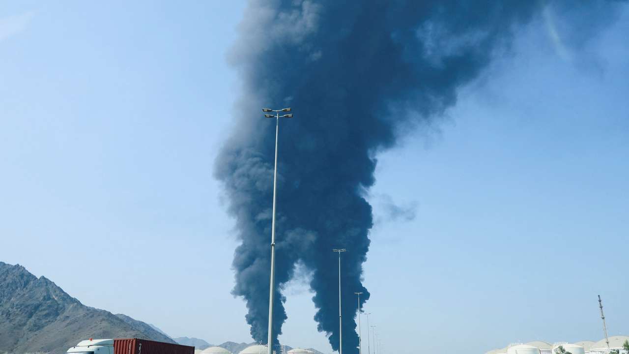 Smoke rises in the Fujairah oil industry zone, caused by debris after interception of a drone by air defenses, according to the Fujairah media office, amid the U.S.-Israel conflict with Iran, in Fujairah