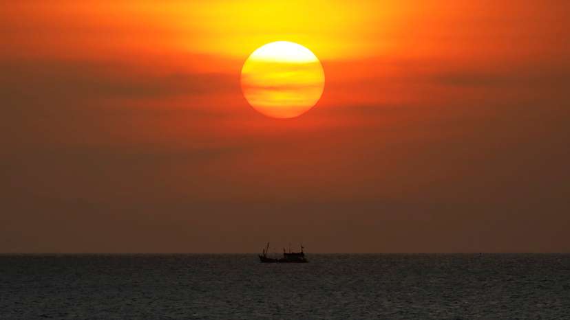 FILE PHOTO: A boat sails on the Gulf Of Thailand during the sunset at Ko Samui in Thailand