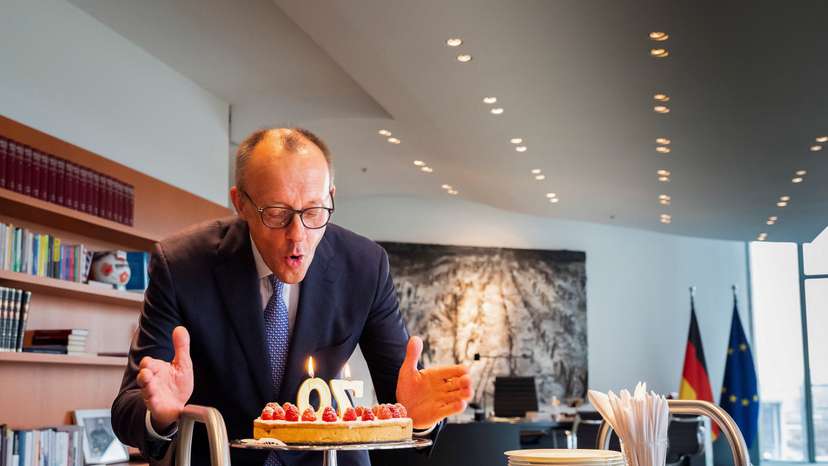 German Chancellor Merz blows out some candles on the occasion of his 70th birthday in Berlin