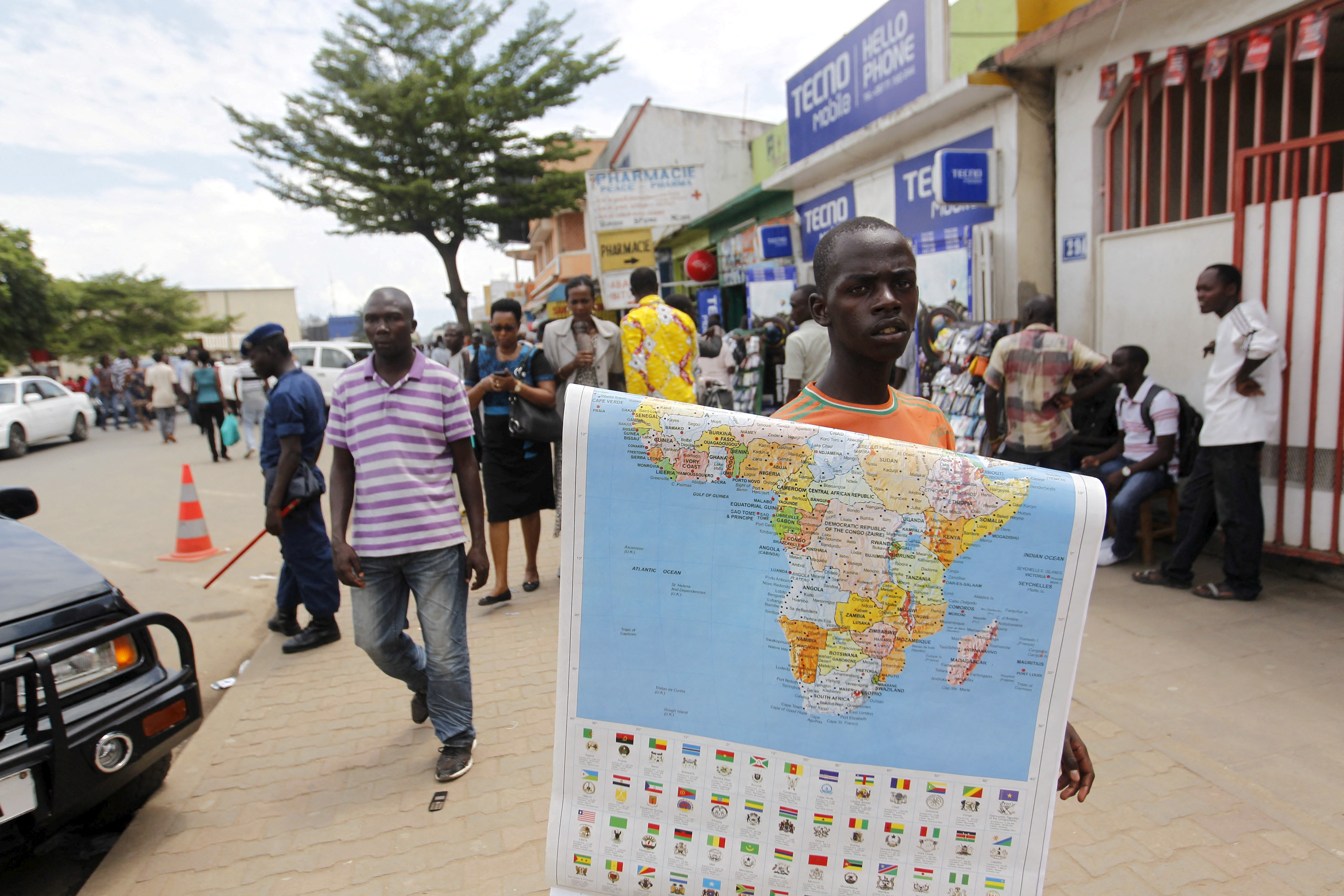 FILE PHOTO: A vendor sells a map of Africa along the streets of Bujumbura, Burund