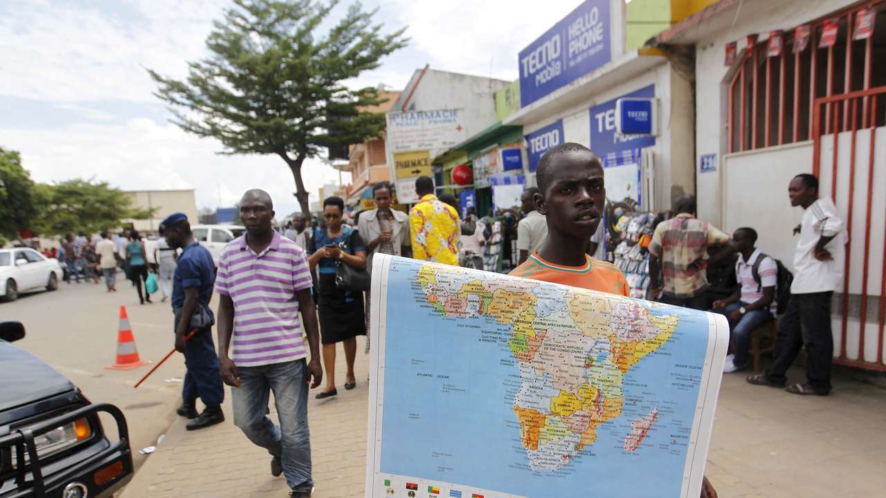 FILE PHOTO: A vendor sells a map of Africa along the streets of Bujumbura, Burund