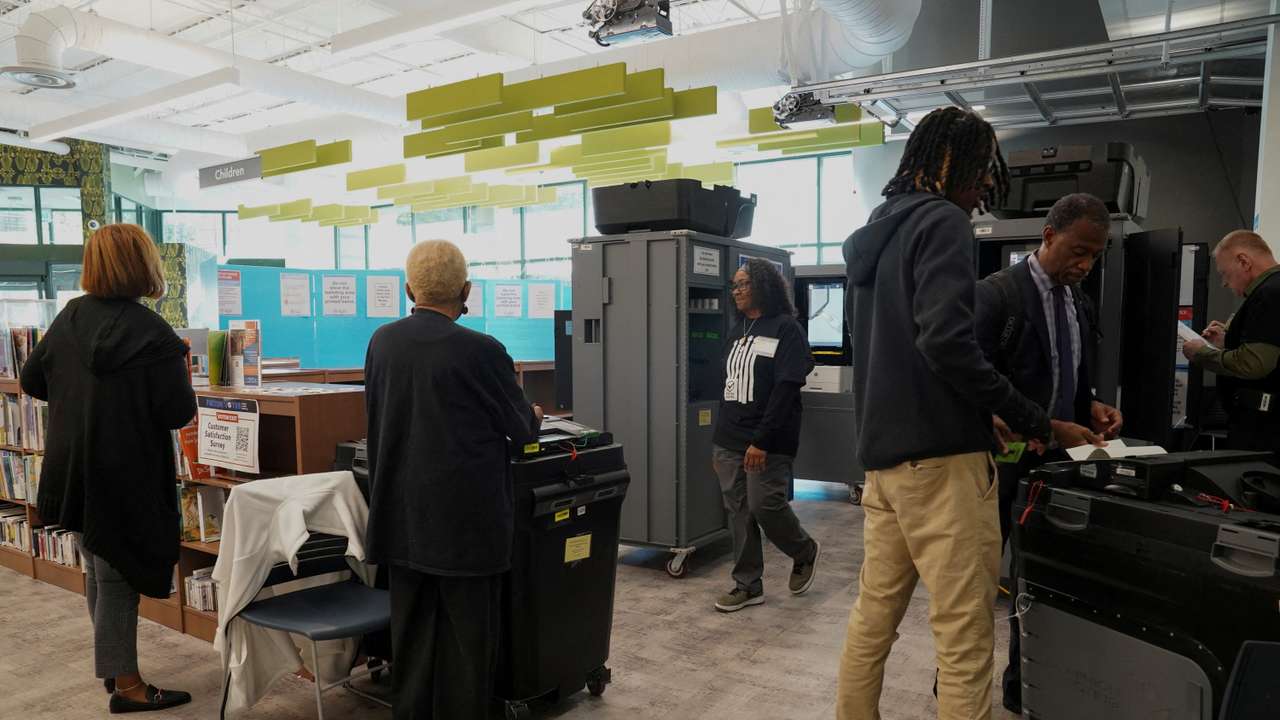 FILE PHOTO: Georgians turned out a day after the battleground state opened early voting