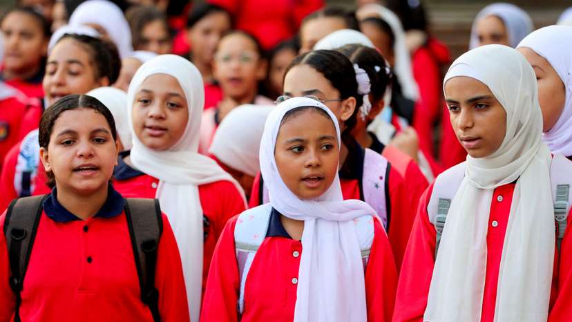 Students line up on the first day of the academic year at Orman school, in Cairo