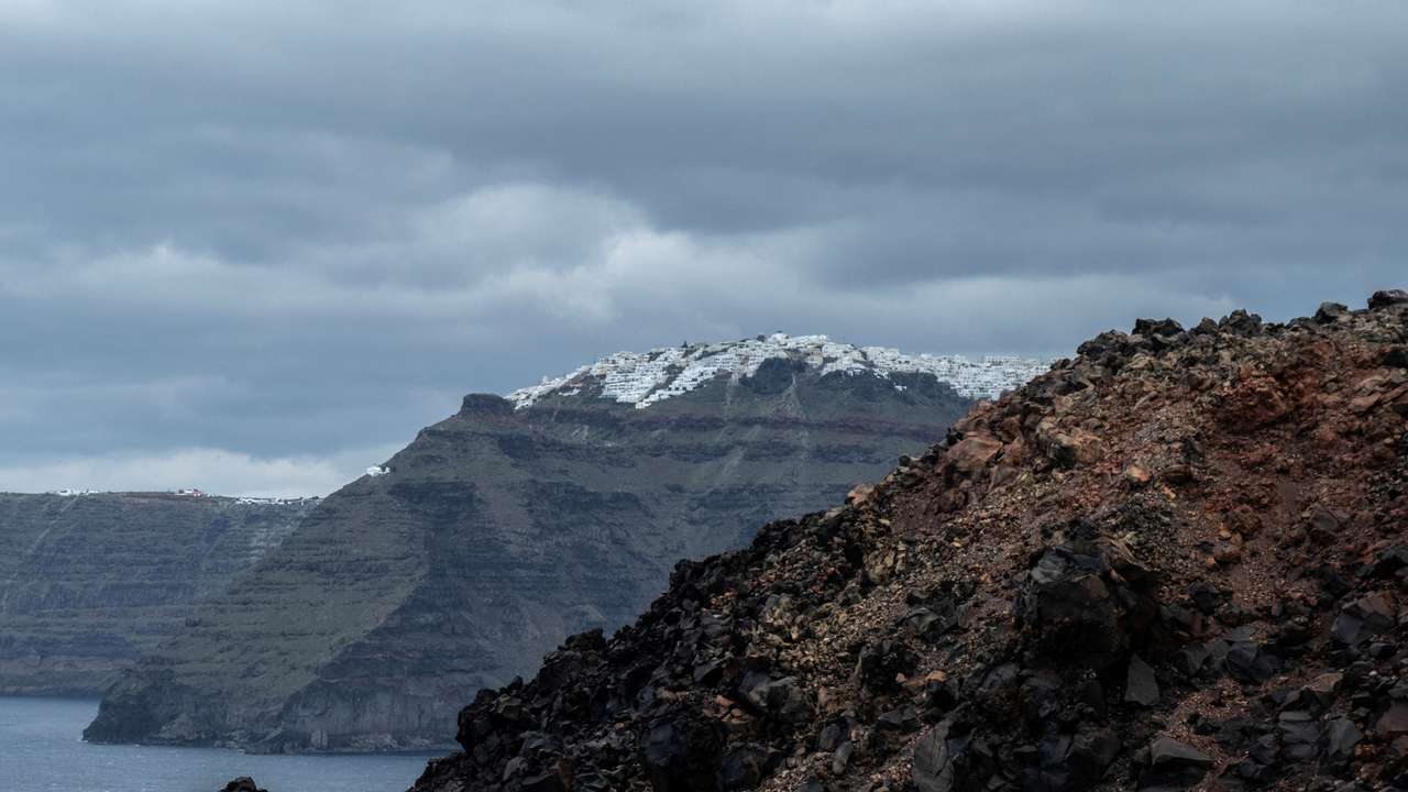 A view of Santorini as seen from the volcanic island of Nea Kameni
