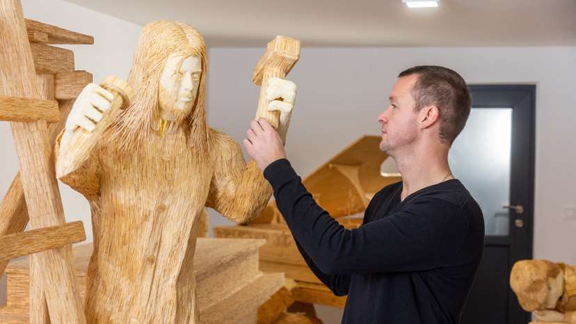 Artist Horvat works on sculpture made of matches in Domasinec