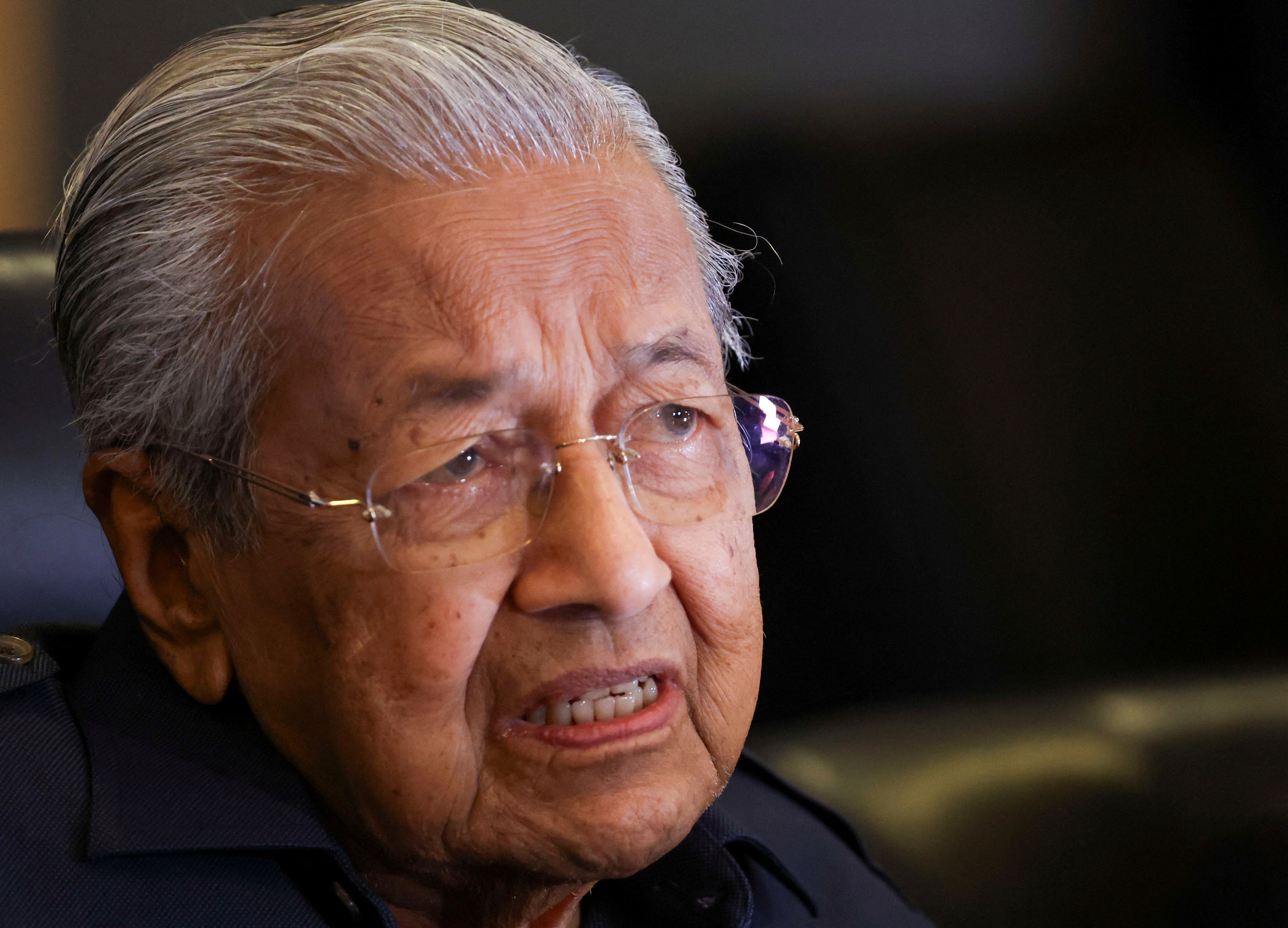 FILE PHOTO: Former Malaysian Prime Minister Mahathir Mohamad holds a press conference at Putrajaya