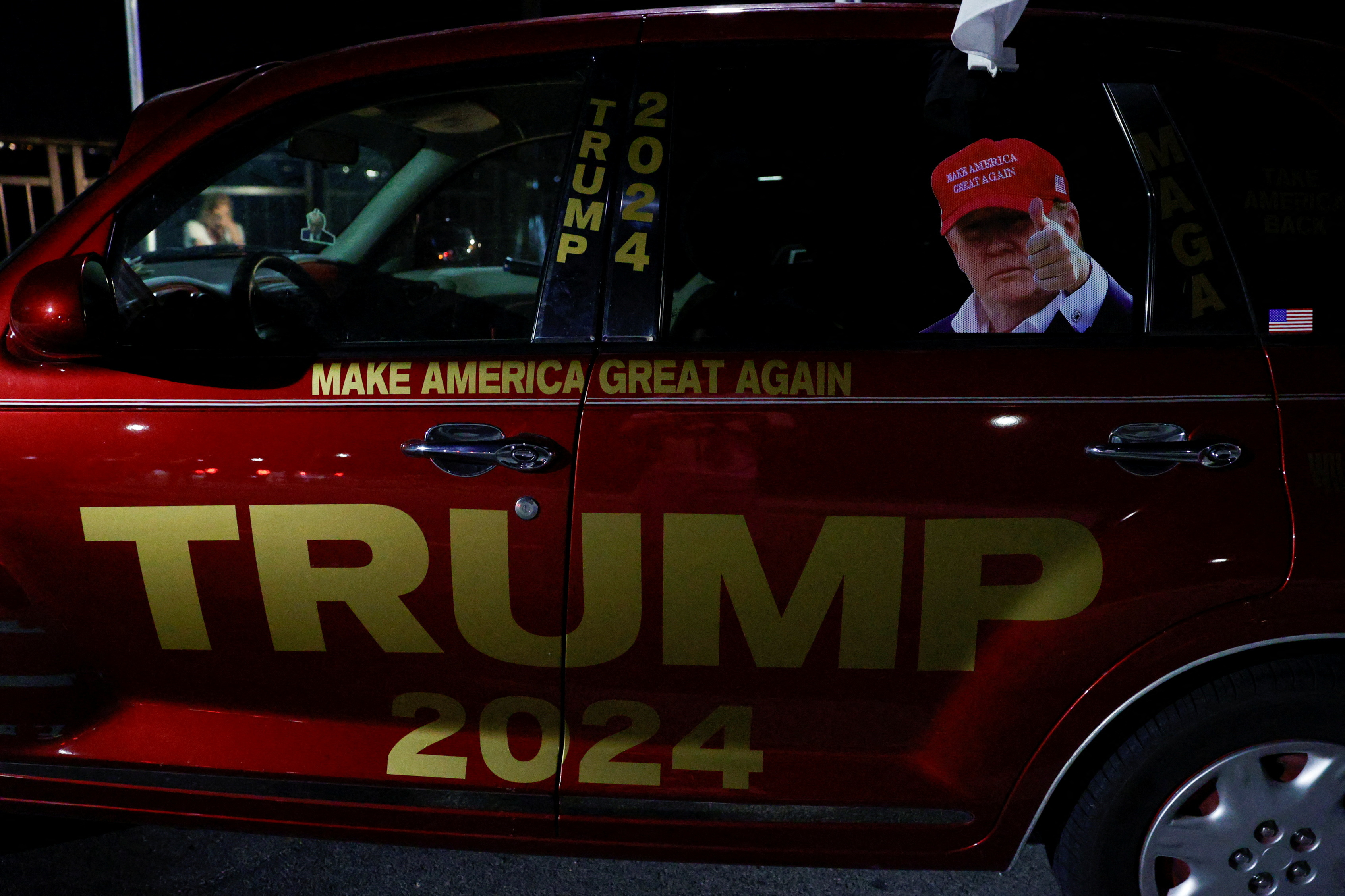 People gather after Republican presidential candidate and former U.S. President Donald Trump was injured when shots were fired, in Palm Beach