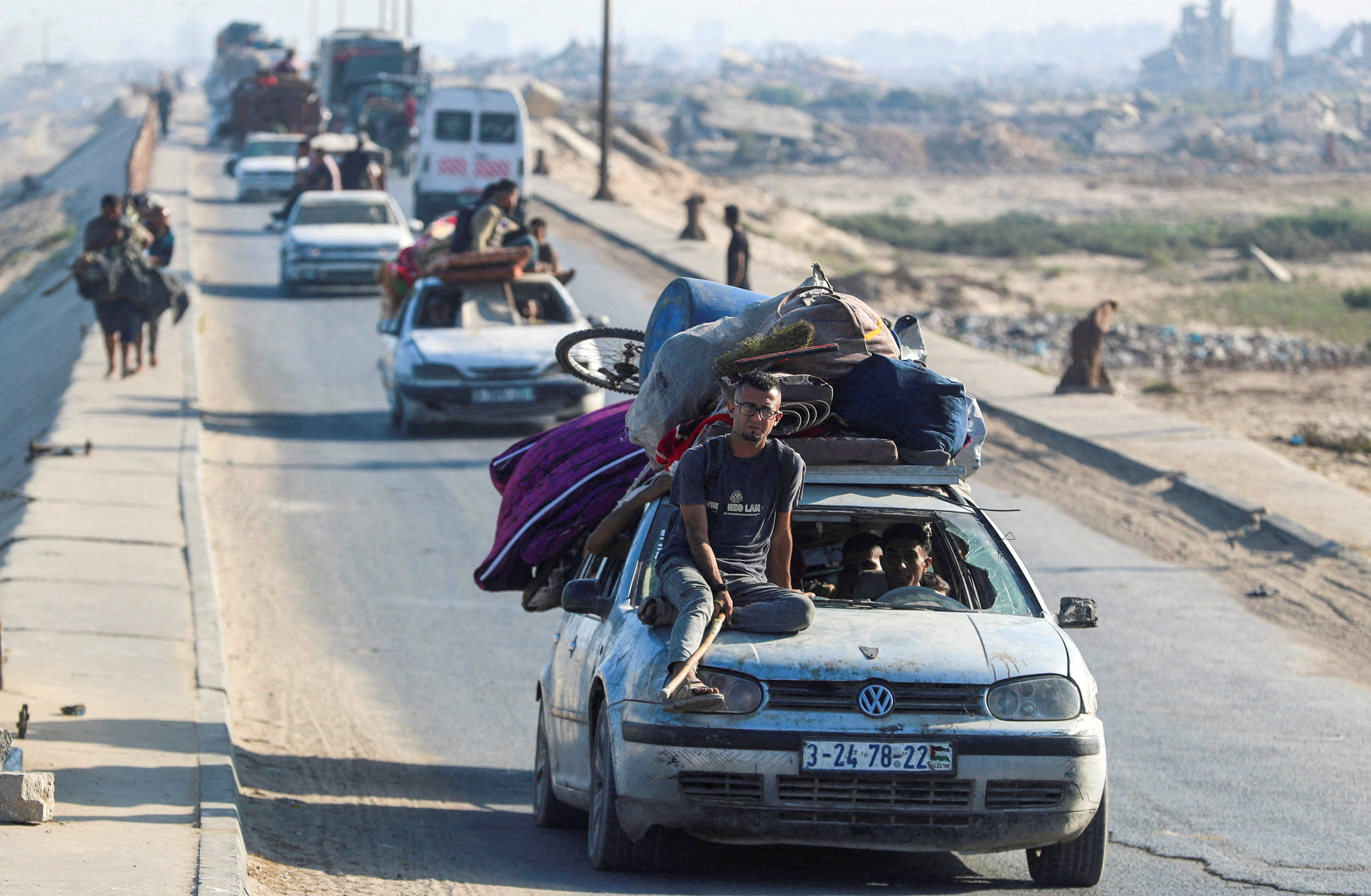Displaced Palestinians, fleeing northern move southward, in the central Gaza Strip