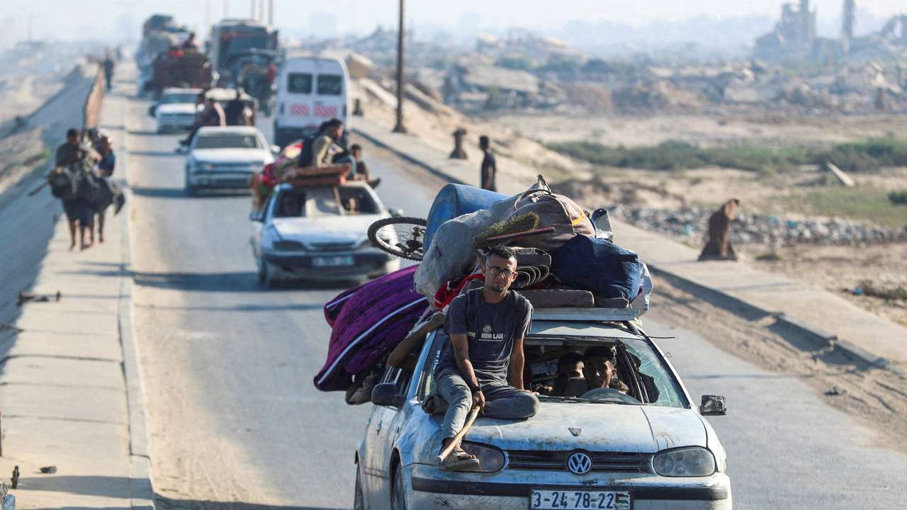 Displaced Palestinians, fleeing northern move southward, in the central Gaza Strip