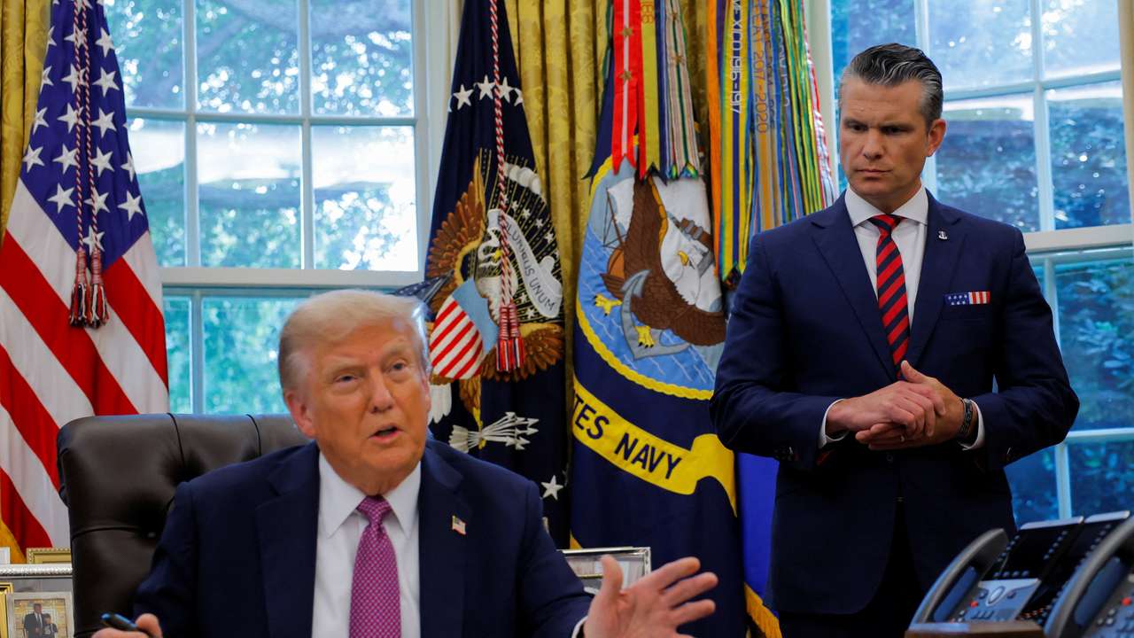 U.S. President Donald Trump signs an executive order at the White House in Washington, D.C.