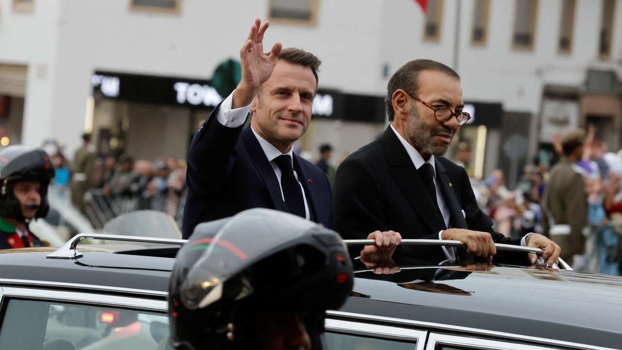 French President Emmanuel Macron greets the crowd in Rabat