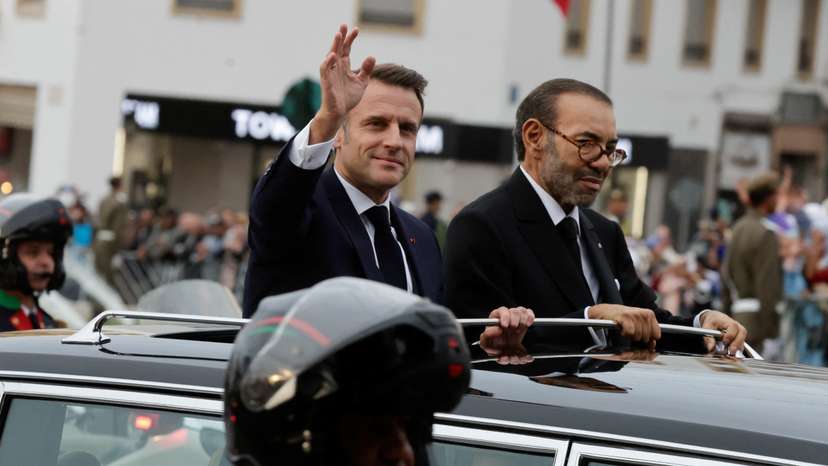 French President Emmanuel Macron greets the crowd in Rabat