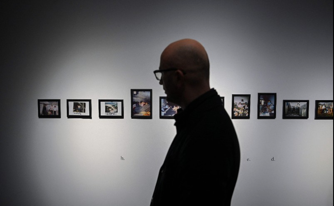 A man visits the Children of War Museum, dedicated to children who experienced Kosovo's 1990s war on its opening day in Pristina