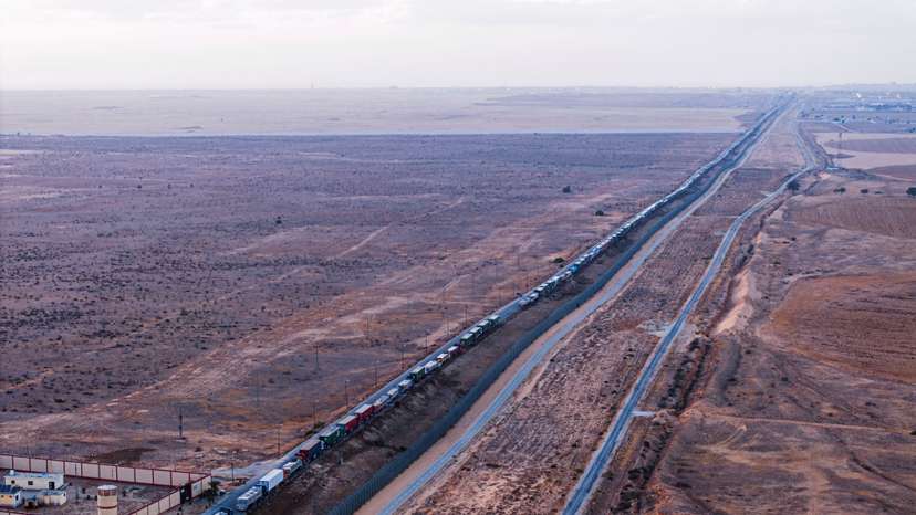 A drone picture of a line of trucks waiting on an Egyptian road along the border with Israel, near the Rafah border crossing with the Gaza Strip