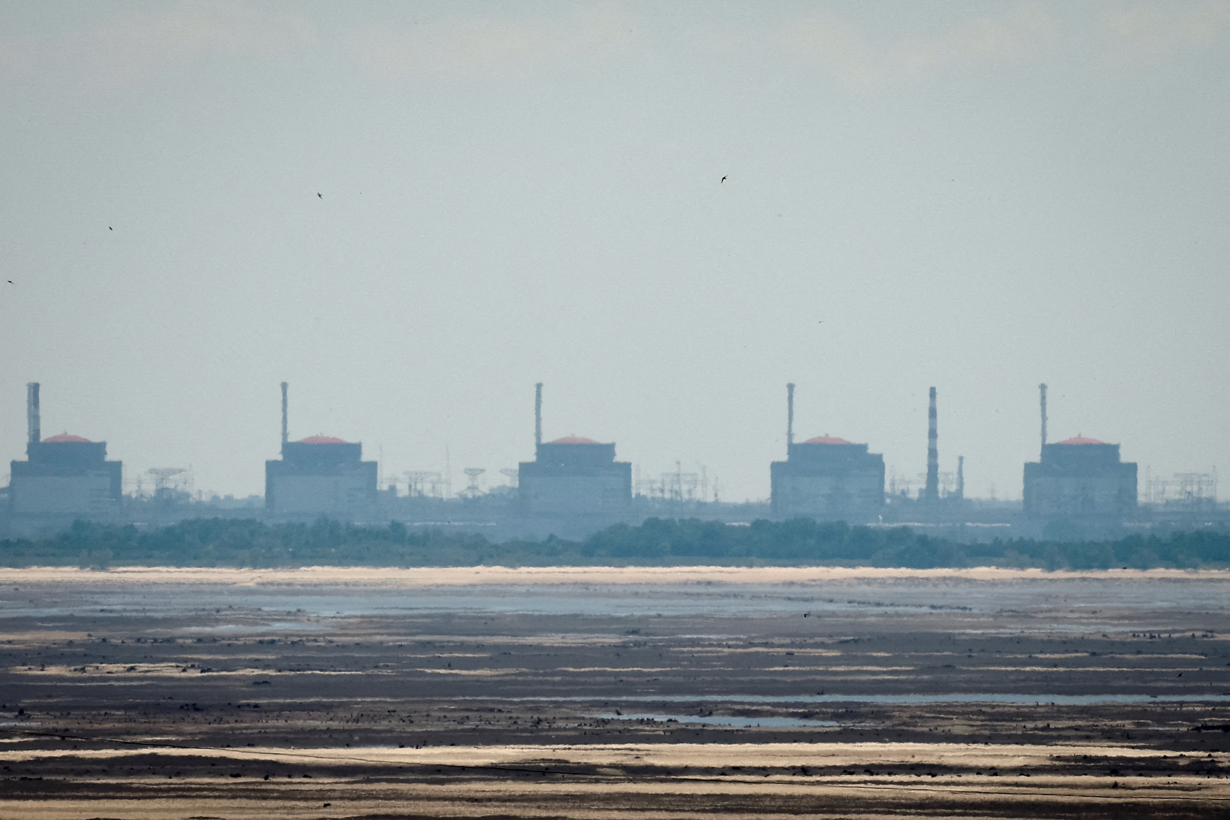 FILE PHOTO: View shows Zaporizhzhia Nuclear Power Plant from the bank of Kakhovka Reservoir in Nikopol