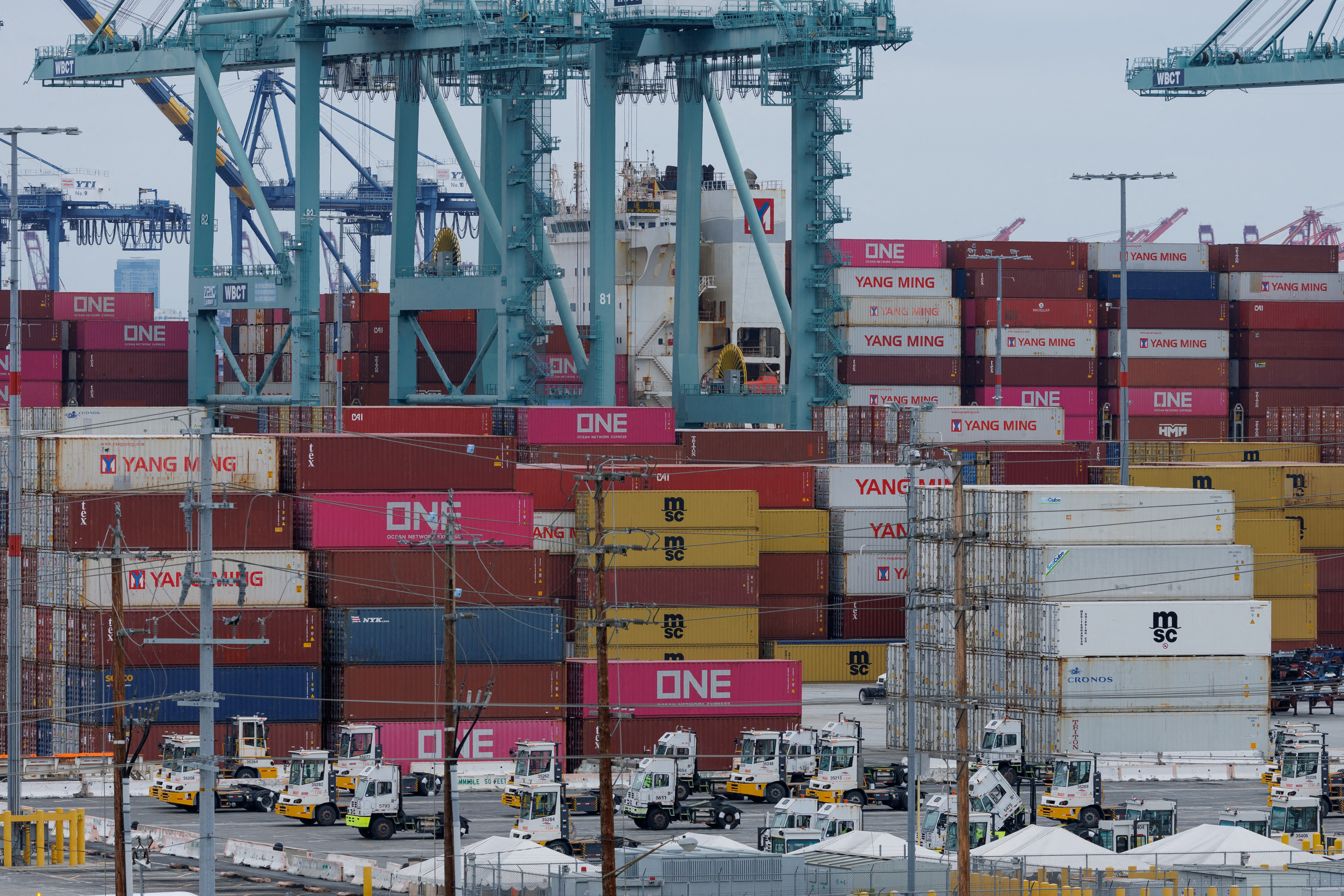 FILE PHOTO: A container ship is unloaded at the Port of Los Angeles, in San Pedro