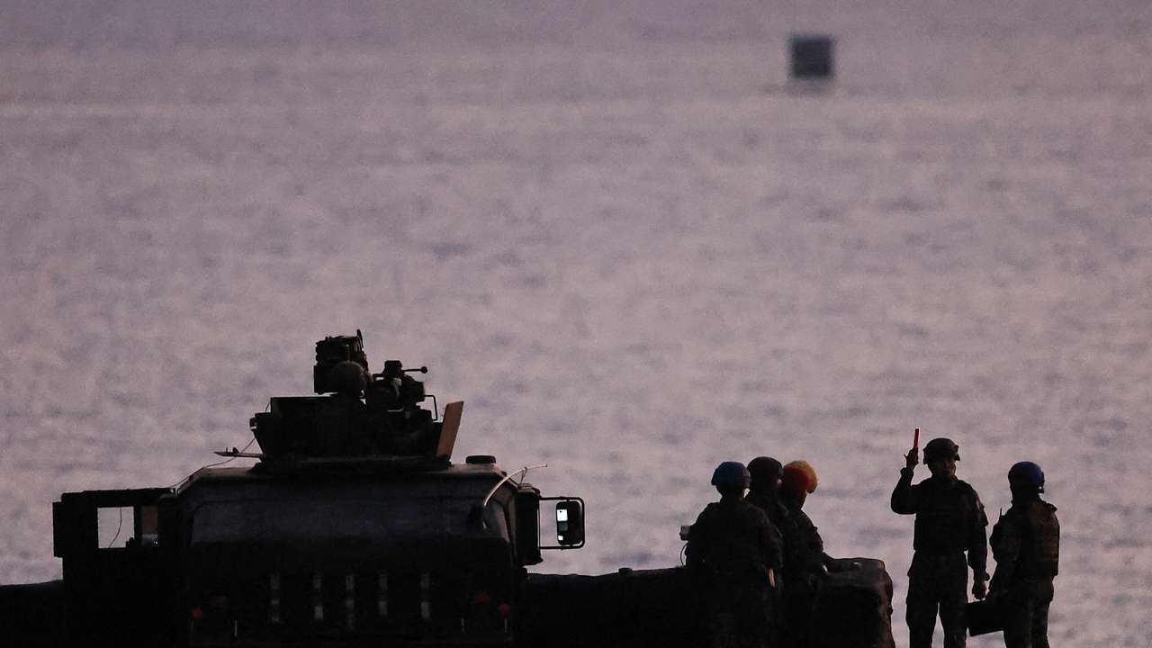 Soldiers prepare for a live fire drill at the Fangshan training grounds in Pingtung