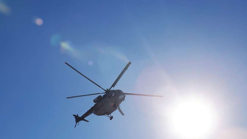 A Russian Mi-8 military helicopter flies in the sky in Donetsk Region