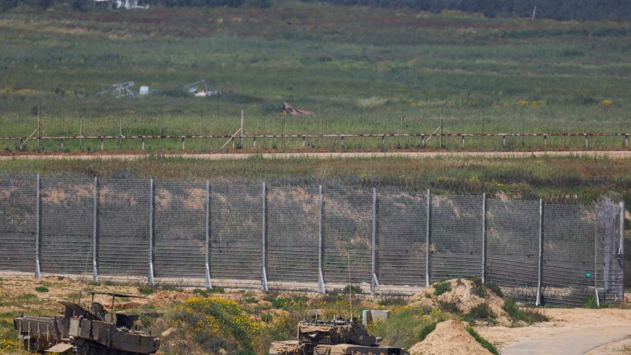 Israeli military vehicles hold position near the Israel-Gaza border