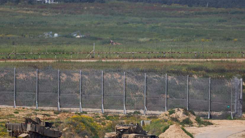 Israeli military vehicles hold position near the Israel-Gaza border
