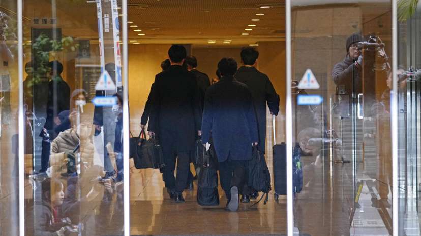 Investigative team members from the Tokyo District Public Prosecutors Office search office of key ruling party faction in Tokyo