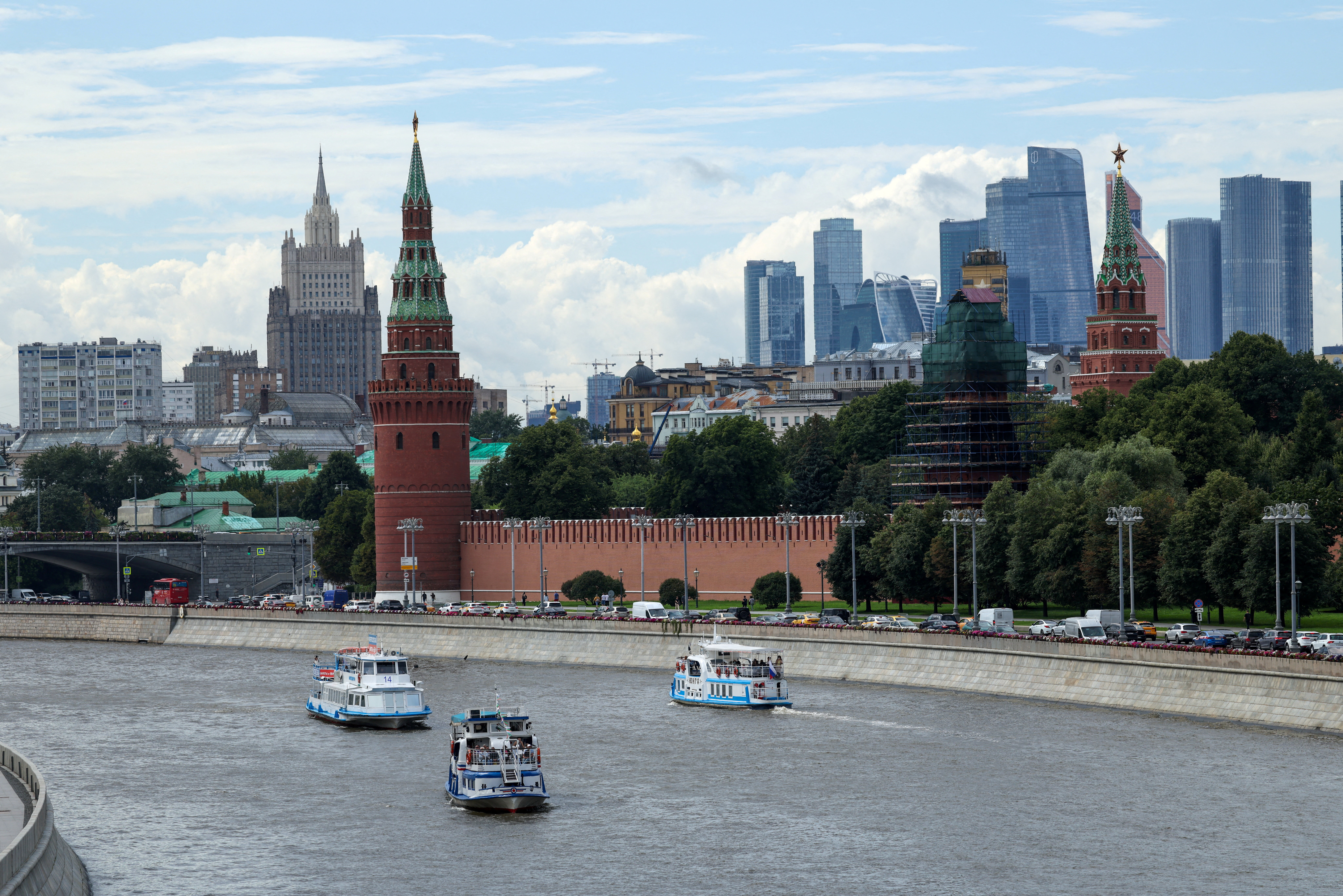 FILE PHOTO: Vessels sail along the Moskva River near Kremlin in central Moscow