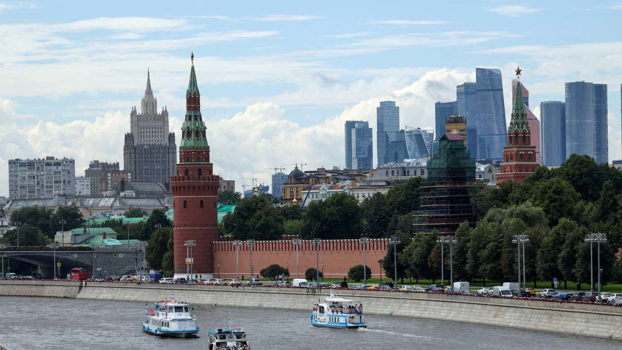 FILE PHOTO: Vessels sail along the Moskva River near Kremlin in central Moscow
