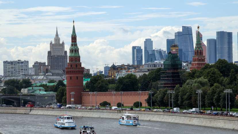 FILE PHOTO: Vessels sail along the Moskva River near Kremlin in central Moscow