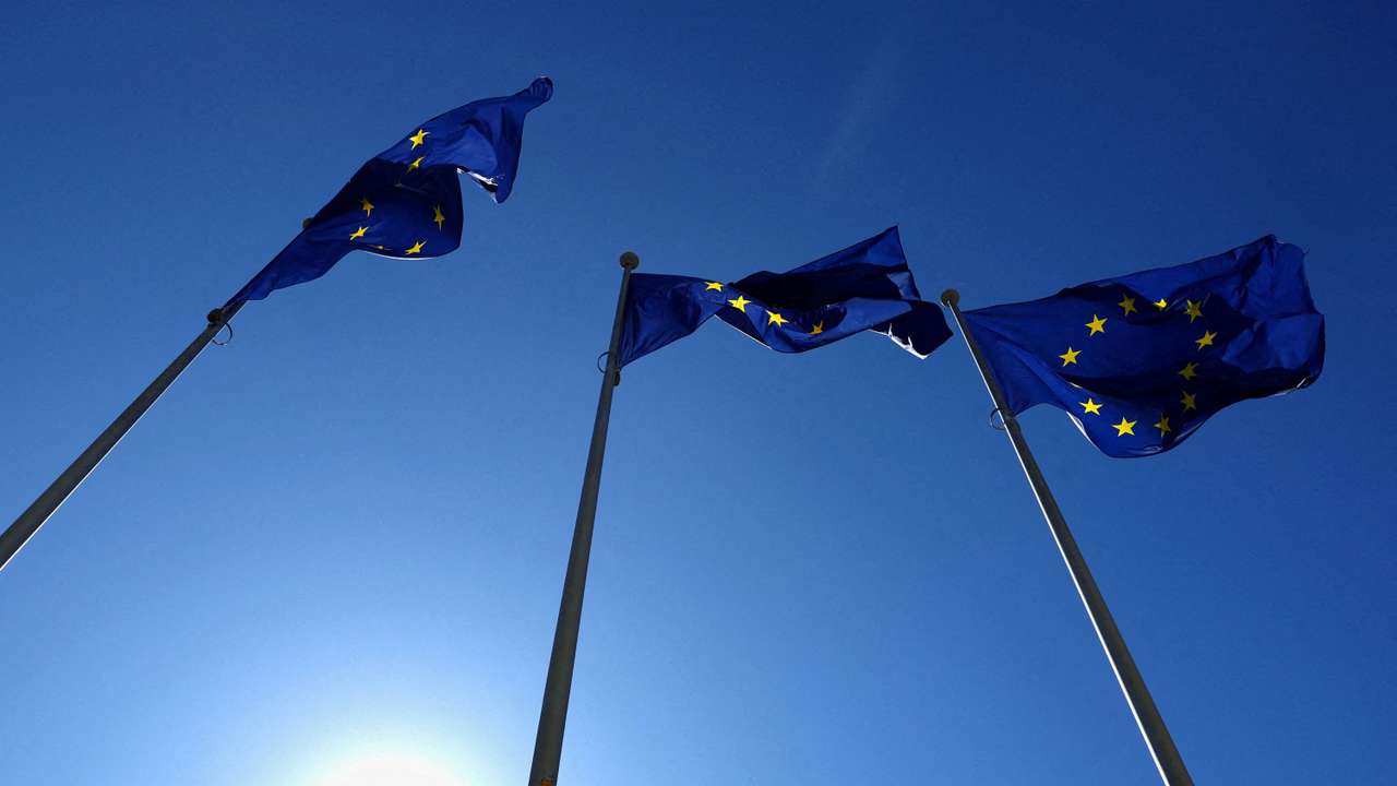 FILE PHOTO: European Union flags flutter outside the EU Commission headquarters in Brussels