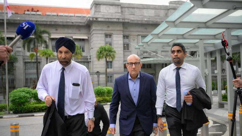 S. Iswaran, Singapore's former transport minister, arrives at the State Courts with his legal team in Singapore