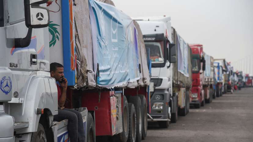 Trucks carrying humanitarian aid to Palestinians, wait on the desert road (Cairo - Ismailia) on their way to the Rafah border crossing to enter Gaza