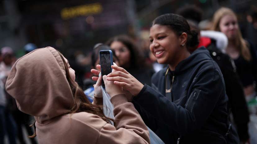 FILE PHOTO: TikTok users in Times Square in New York City