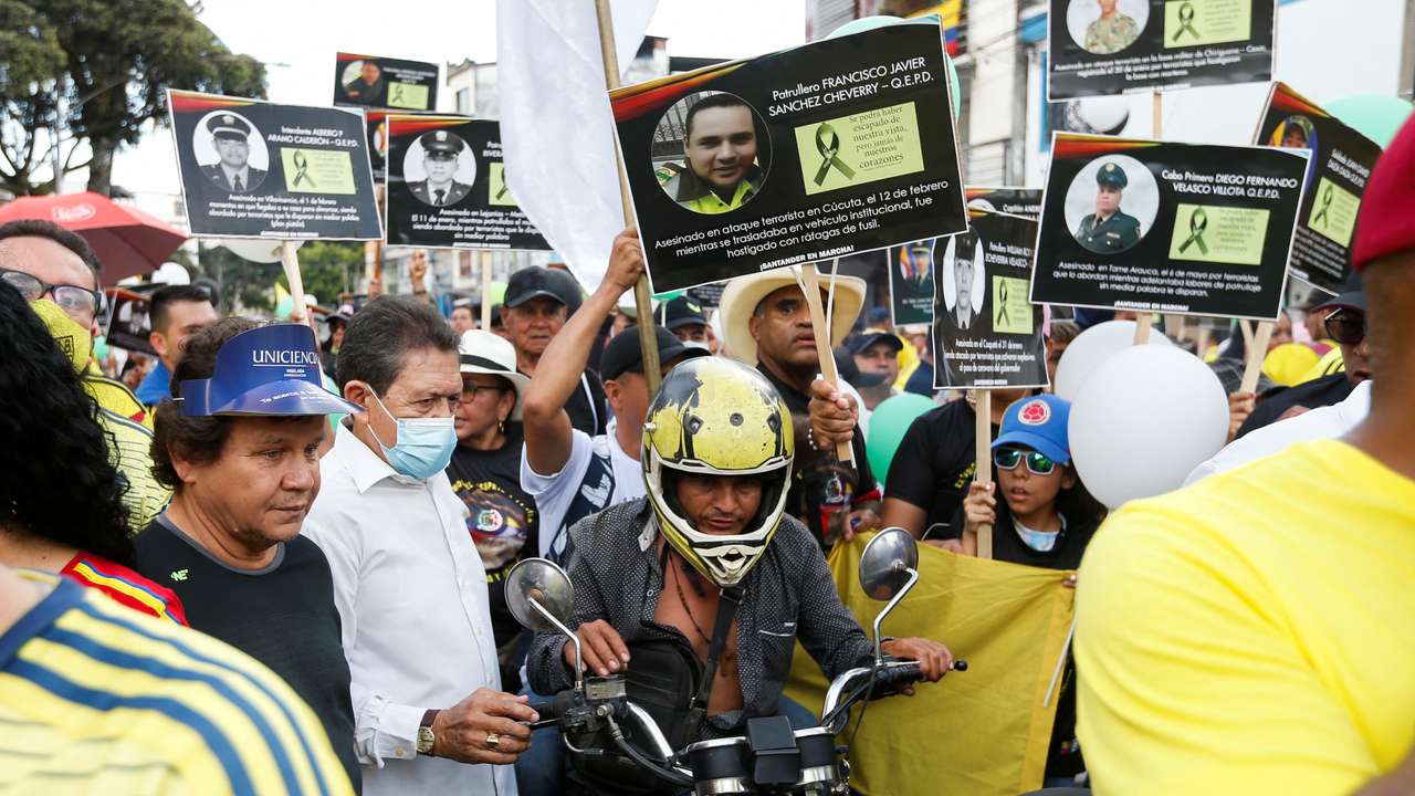 People protest against the killings of police officers by the Clan Del Golfo criminal gang, according to authorities, in Bucaramanga