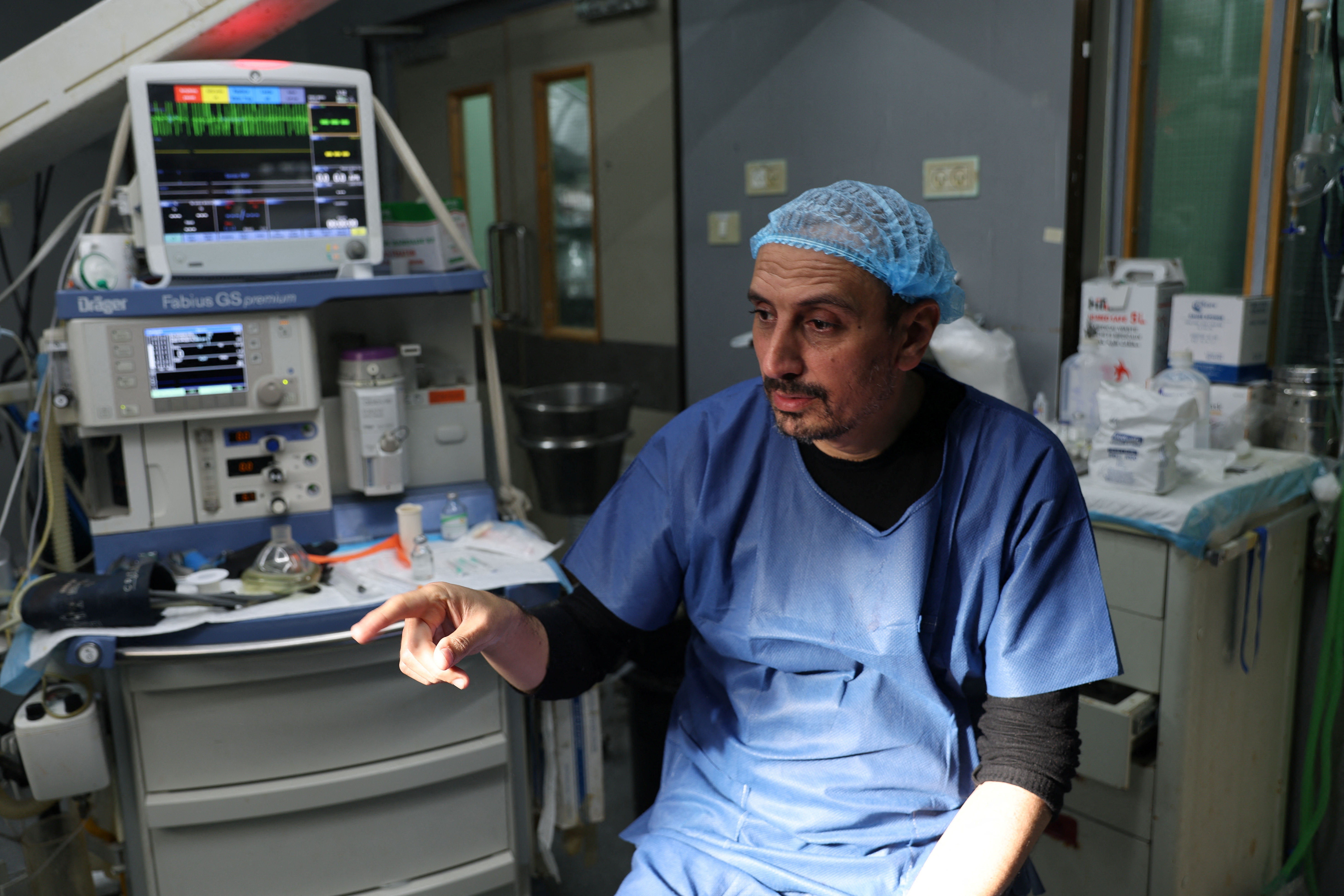 Palestinian doctor Ahmed Al-Mughraby speaks to Reuters at Gaza European Hospital in Khan Younis