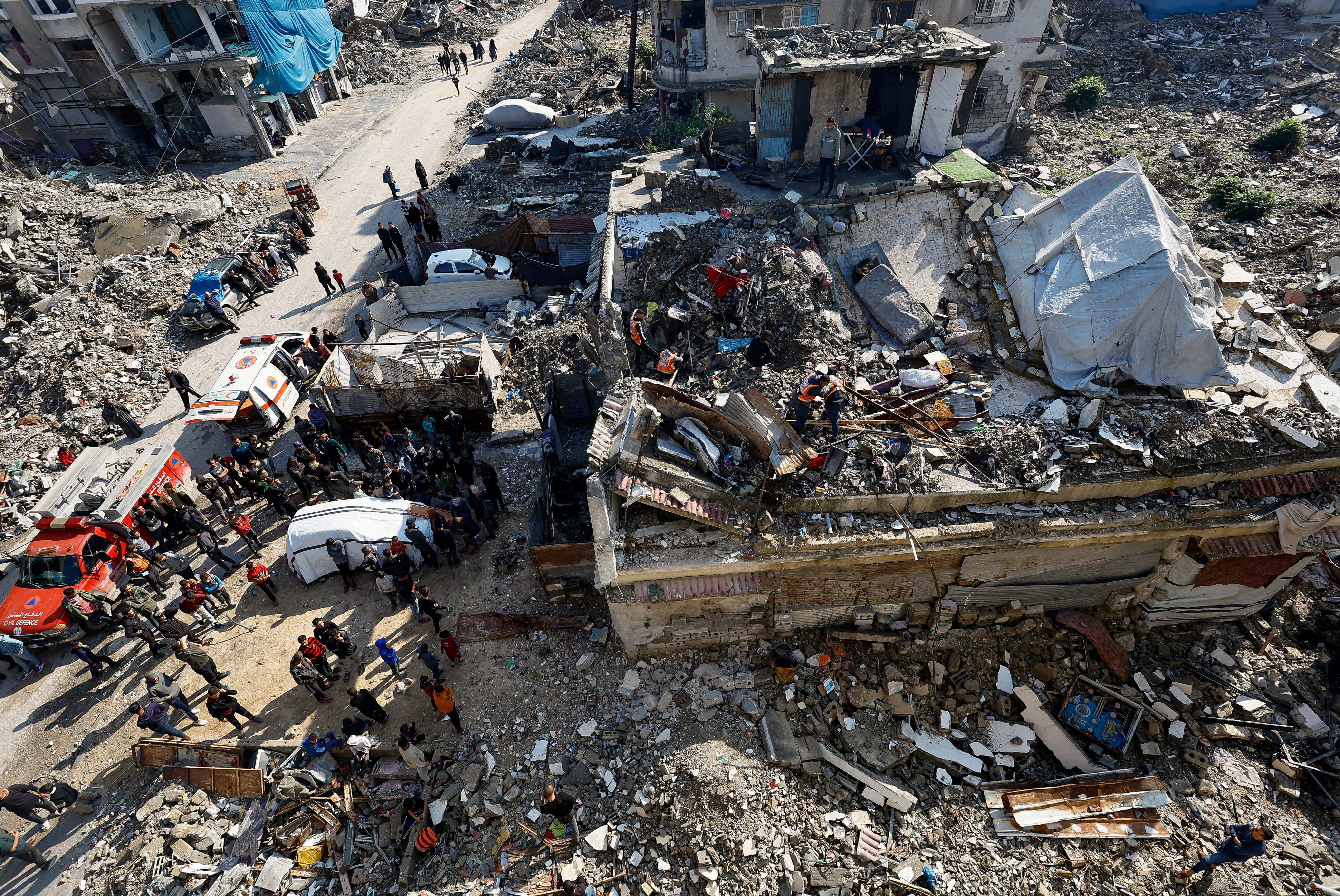 Search and rescue operation at the site of a house that was partially destroyed during the war and collapsed on Tuesday, in Gaza City