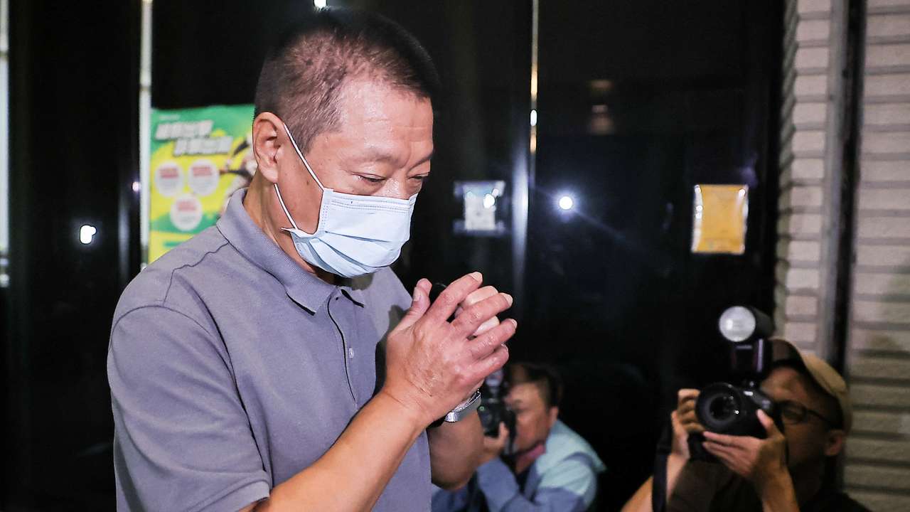 Hsu Ching-kuang, founder and president of Gold Apollo, arrives at Taiwan Shilin District Prosecutors Office in Taipei